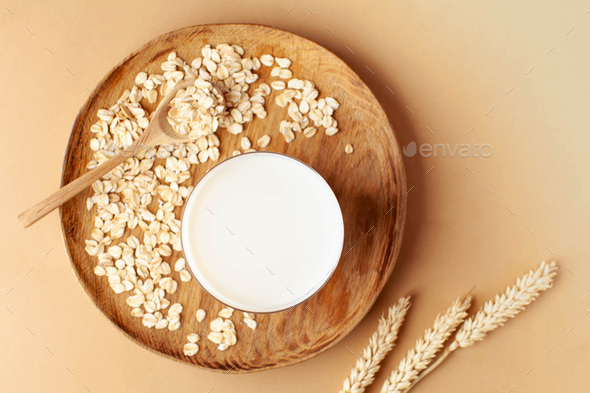 Oat milk in a glass. Milk substitute, milk for vegetarians. - Stock Photo - Images