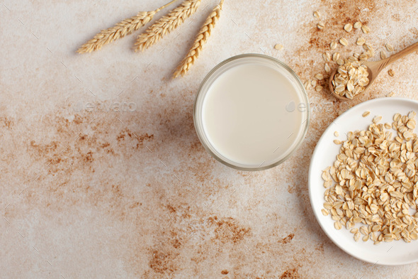 Oat milk in a glass. Milk substitute, milk for vegetarians. - Stock Photo - Images