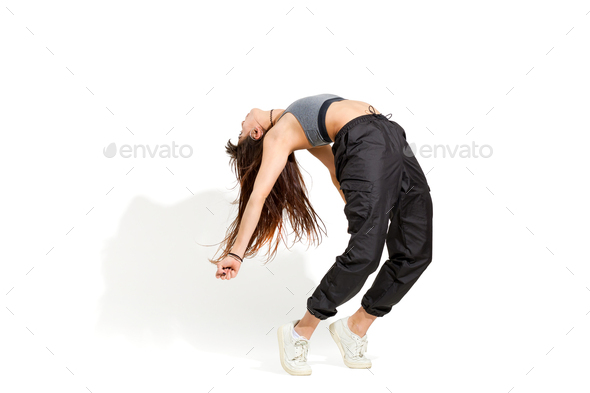 Modern dancer poses in front of the gray studio background Stock Photo by  ©nazarov.dnepr@gmail.com 228217202