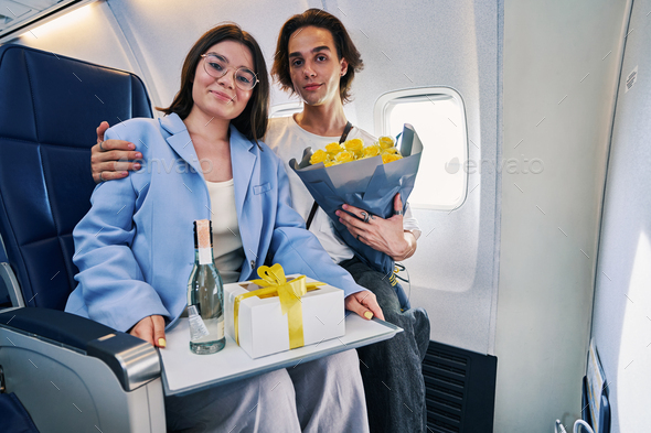 Romantic couple celebrating their anniversary aboard the aircraft