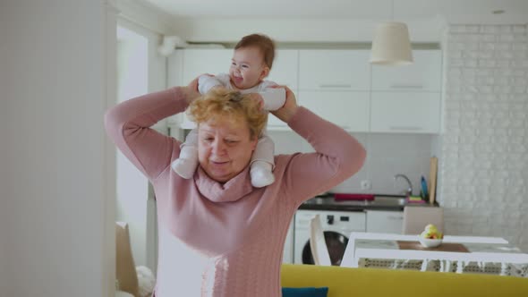 Tender Affectionate Older Grandma Hugging Cute Baby Granddaughter alt