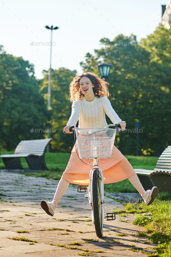 A girl riding a nike and having fun - Stock Photo - Images