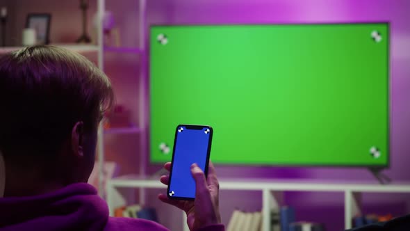 Man Watching Television in Living Room in Evening alt