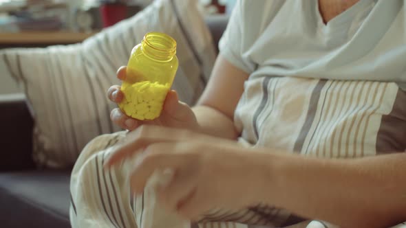 Man Taking Handful of Pills alt