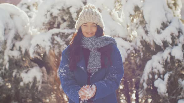 Woman Throws Snowball Hitting Camera. Slow Motion High Quality Sharp Footage alt