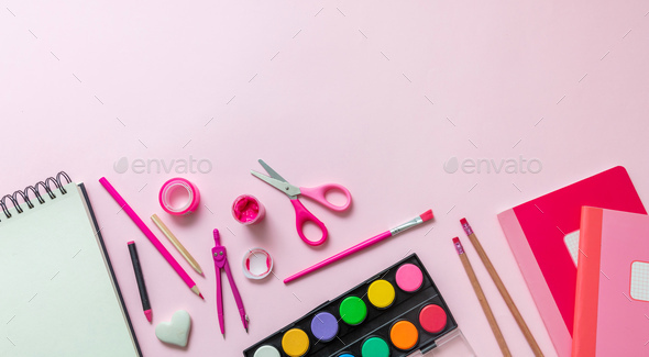 School supplies flat lay, stationery on pink background. Education