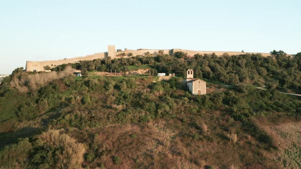 Revealing Shot Of Obidos Castle Behind Wall In Portugal With Ermida de Nossa Senhora do Carmo Chapel alt