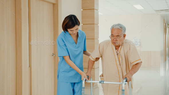 Young Asian woman nurse caregiver assistance encourage take care her senior patient explain. - Stock Photo - Images