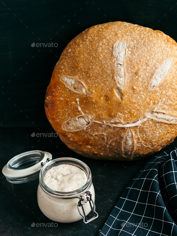 Wheat round sourdough bread, copy space, vertical