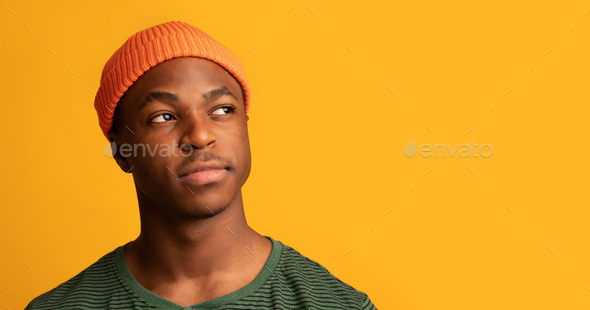 Serious Young Black Guy In Orange Hat Aside At Copy Space Stock Photo Prostock-studio