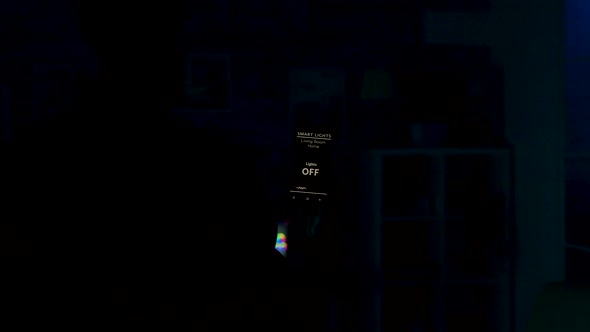 Man Uses Voice Activated Smart Lights App on His Smartphone To Tun on the Lights in the House alt