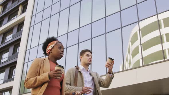  Business Colleagues Chatting and Walking Outside alt