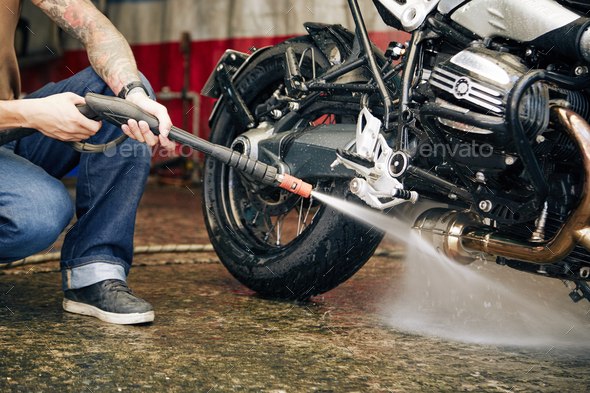 Motorcyclist Washing His Bike
