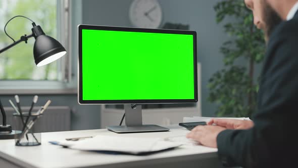 Man Working on Pc with Green Screen