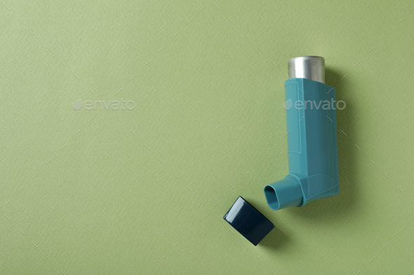 Blue asthma inhaler on green background, top view Stock Photo by ...