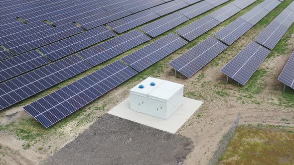 Drone View on a Solar Power Station in the Field, Lots of Solar Panels,  alt