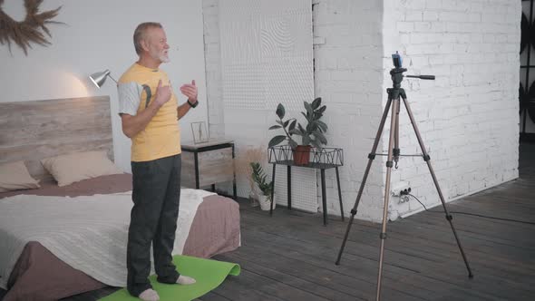 Old Man Influencers Gives a Recommendation in His Blog About Health and Sport for Elderly People alt