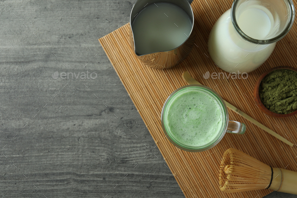 Matcha latte and accessories for making on white wooden table Stock Photo  by AtlasComposer