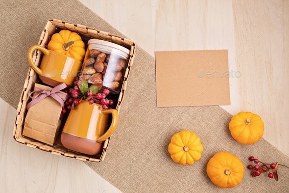 Preparing care package for thanksgiving, sasonal gift box with cup, tea or coffee package and