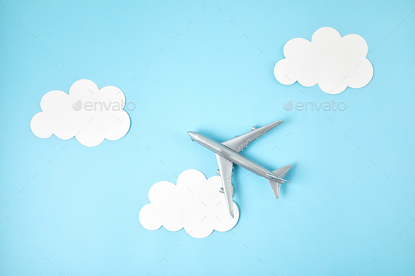 Miniature airplane. Travel tourism, airlines, low cost flights concept. Top view, flat lay