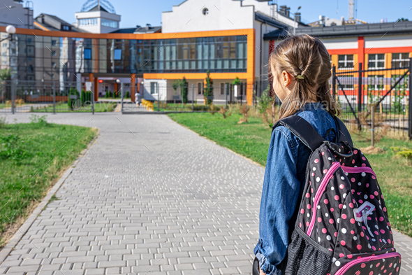 A Little Girl Going To School With Bag Pack. Back To School