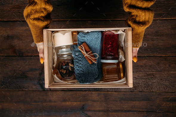 Care box, package ideas. Fall or Winter care box with sweets and warm clothes. Care Package Delivery