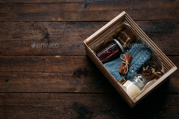 Care box, package ideas. Fall or Winter care box with sweets and warm clothes. Care Package Delivery