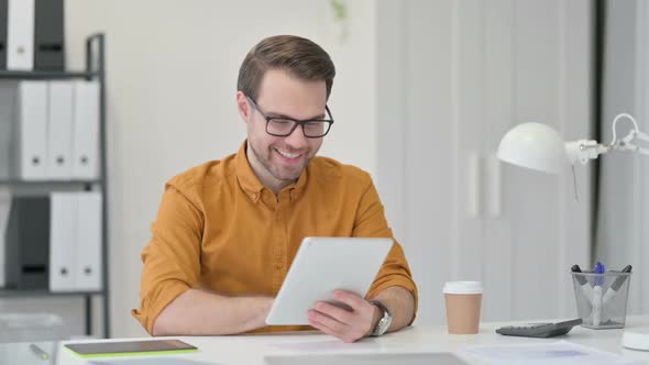 Video Chat on Tablet By Young Man alt