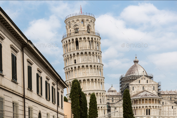 Leaning tower and buildings on Square of Miracles (Piazza dei Miracoli) in Pisa, Italy - Stock Photo - Images