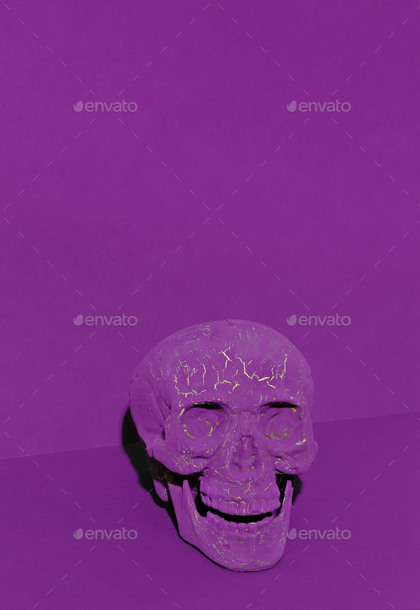 Purple skull on purple space. Minimal still life art. Halloween concept