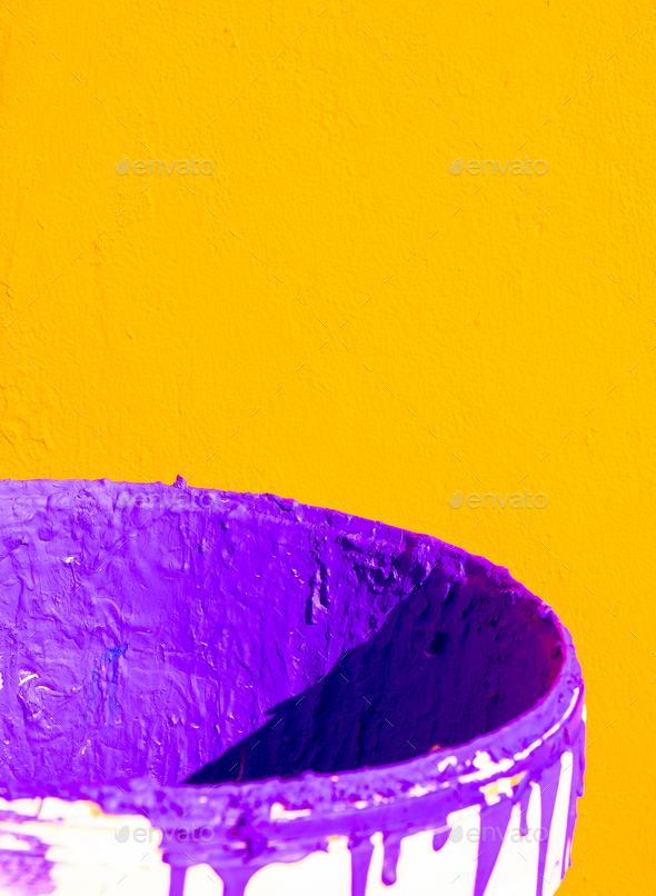 Creative stylish wallpaper. Purple paint and yellow wall. Minimalist