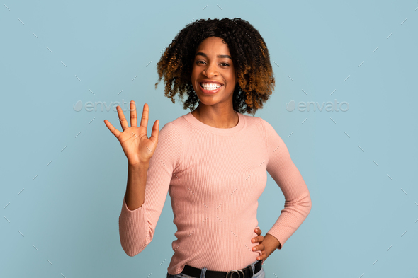 Hello. Cheerful Friendly Young African American Woman Waving Hand At Camera - Stock Photo - Images