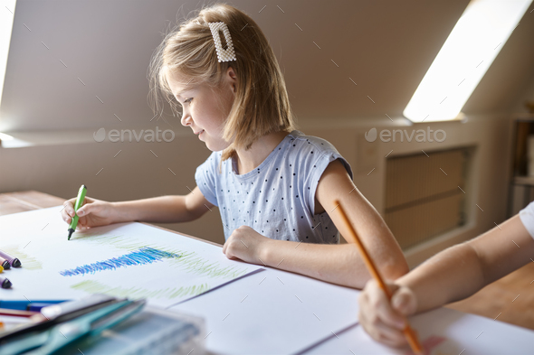 Little girl drawing with markers, kid in workshop - Stock Photo - Images