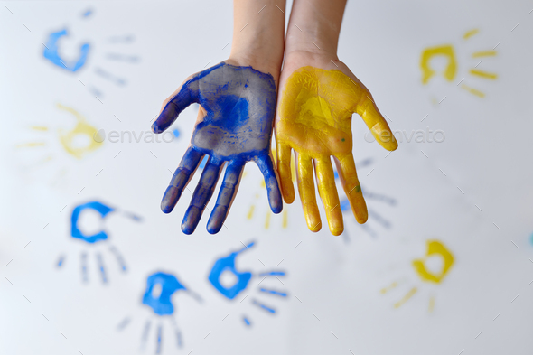 Girl hands painted with gouache, kid in workshop - Stock Photo - Images