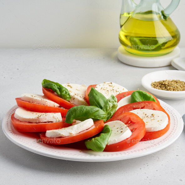 Mediterranean italian caprese refreshment. Sliced detox salad. Fresh healthy appetizer - Stock Photo - Images
