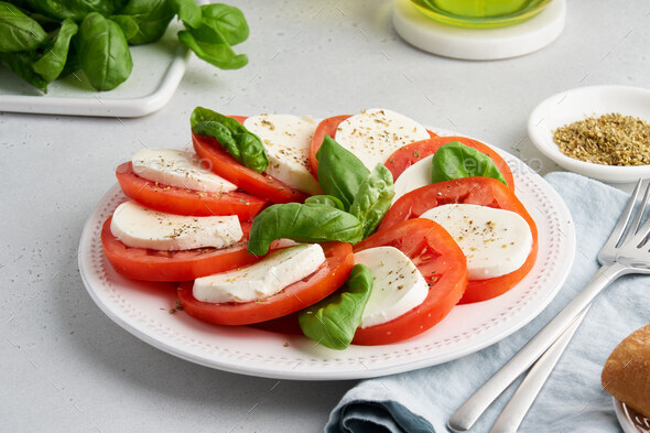 Appetizing italian caprese salad. Mediterranean healthy fresh classic rustic appetizer - Stock Photo - Images