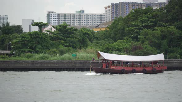 Traditional thai long-tail boat run along the river with network of river trams and taxi alt
