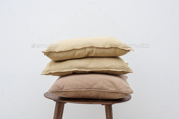 Minimal linen cushion covers on a chair