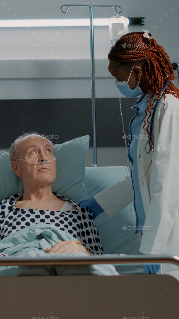 Nurse and african american doctor looking at patient results