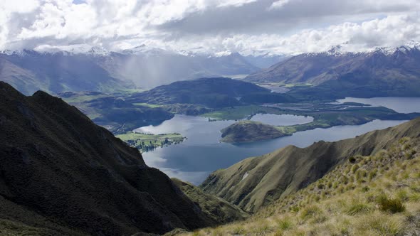 Timelapse Roys Peak near Wanaka. Background is lake and valley alt