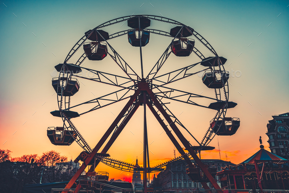 Ferris wheel at sunset - popular park attraction - Stock Photo - Images