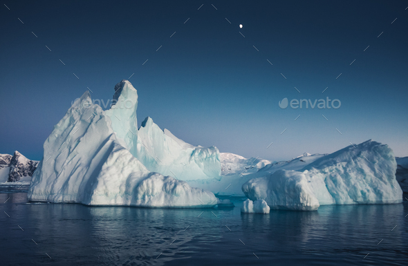 Close-up iceberg next to the Antarctica shoreline - Stock Photo - Images