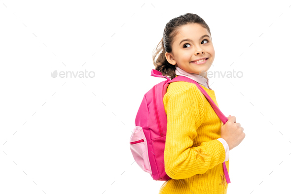 adorable child smiling and holding pink backpack straps isolated on white