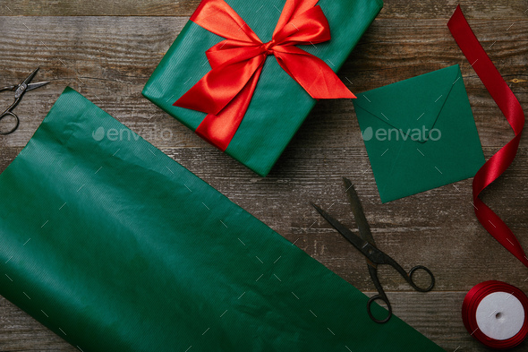 Placeit - Wrapping Paper Mockup with Scissors and Gift Items Above