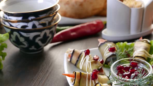 Eggplant Rolls Stuffed with Walnuts and Dressed with Pomegranate Seeds Beautiful Food From Asia alt