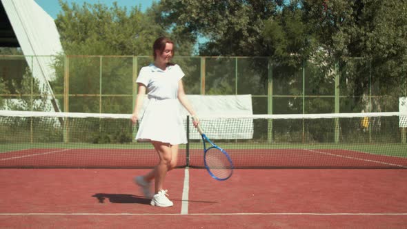 Happy Sportswoman Dancing on Court During Workout