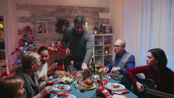 Teen Age Girl Singing at Her Guitar While Celebrating Christmas alt