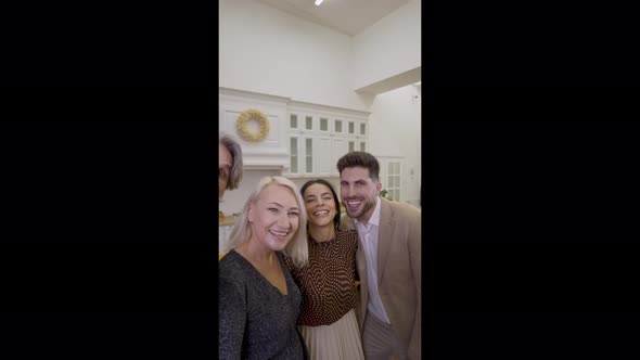 Happy Family Taking Selfie on Smartphone During Holiday Celebration at Home alt