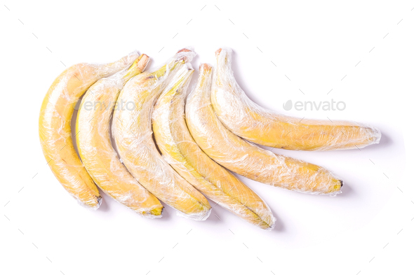 Banana fruits wrapped in stretch wrap plastic isolated background