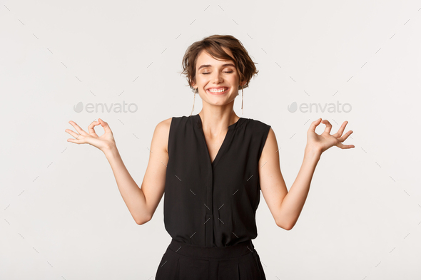 Plus size body positivity woman doing meditation on yoga mat with